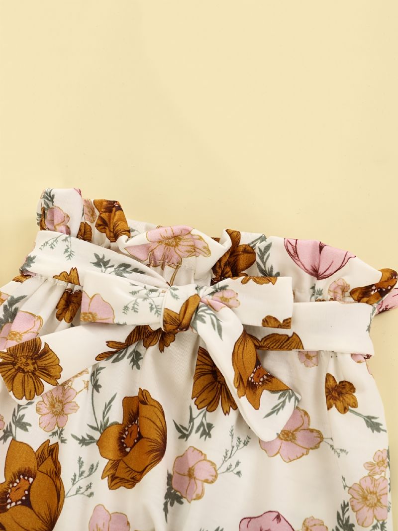 Sød Babypige Buksersæt Med Strikket Flæsede Bukser Og Med Blomsterprint Og Sløjfebånd
